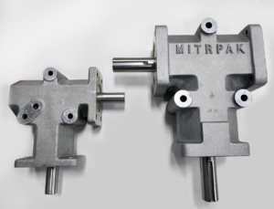 Two T-shaped mitrpak right angle gearboxes, a small and large model comparison