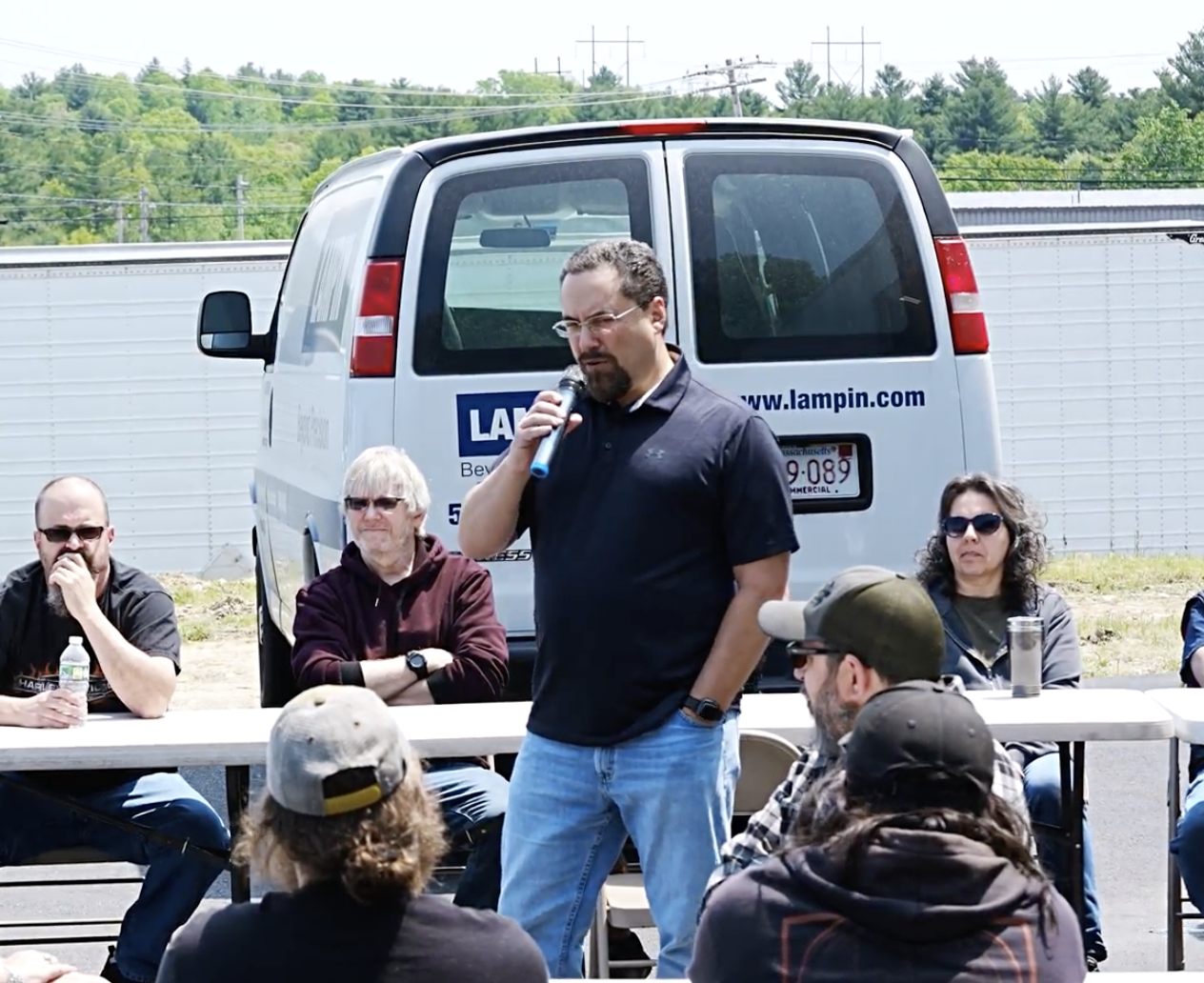 John Biagioni, President of Lampin Corporation, addresses a group of employee-owners at their 2023 employee appreciation event.